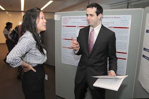 Second-year students Angela Jia and Matthew Schelke chat between sessions at Medical Student Research Day.